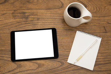 Obraz na płótnie Canvas Digital tablet, coffee, notepad and pen from above
