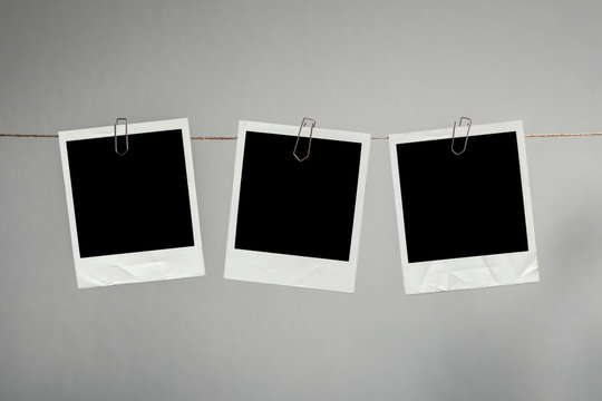 Polaroid Fotos an Wäscheleine aufgehangen
