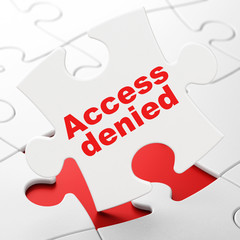Protection concept: Access Denied on puzzle background