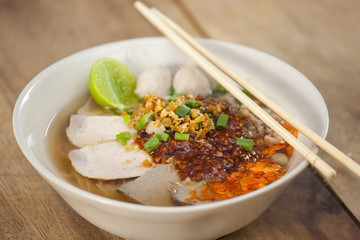 Pork meatballs with spicy sauce in noodle soup