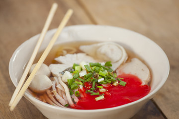 Pork meatballs and steam fish in noodle soup