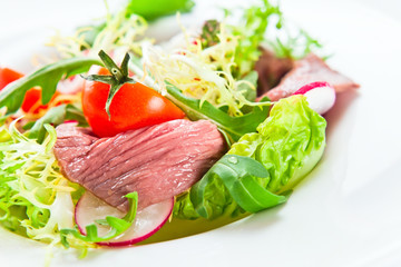 fresh salad with greens and meat