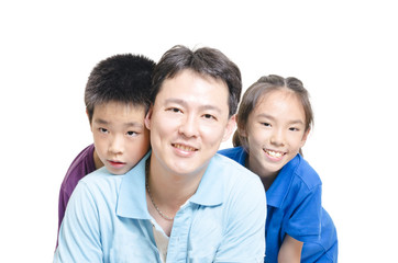 Children with father smilling to the camera