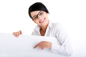 Business woman showing blank signboard