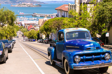 San Francisco Hyde Street and vintage car with Alcatraz