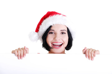 Santa girl holding blank board