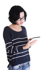 Young pretty woman working on tablet computer