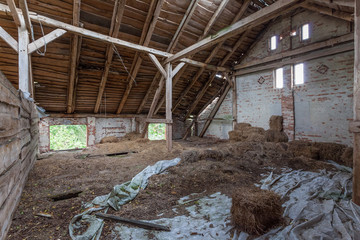 Fototapeta premium Interior of an old, decaying barn