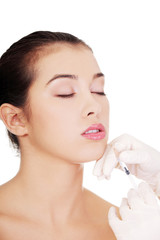 Fototapeta premium Cosmetic botox injection in the female face