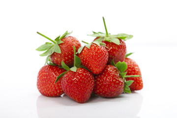 Fototapeta na wymiar Fresh looking delicious strawberries in bulk, isolated with white ground. health food concept.