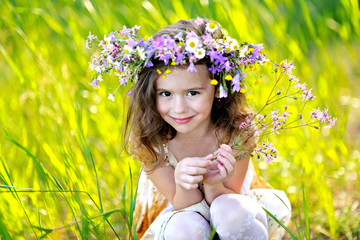 portrait of little girl outdoors in summer © zagorodnaya