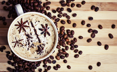 Cup of aromatic coffee and coffee beanes/coffee background