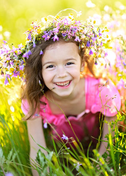 portrait of little girl outdoors in summer