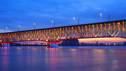 Illuminated bridge at night