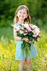 portrait of little girl outdoors in summer