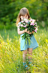 portrait of little girl outdoors in summer