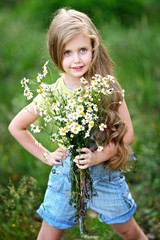 portrait of little girl outdoors in summer