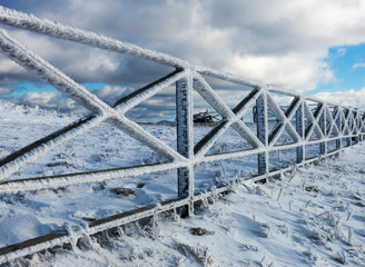 Icy fence in snowy Carpathians