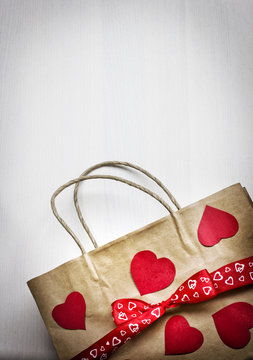 Valentine's gift bag with red ribbon and heart