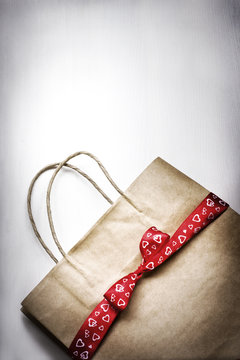 Valentine's gift bag with red ribbon and heart
