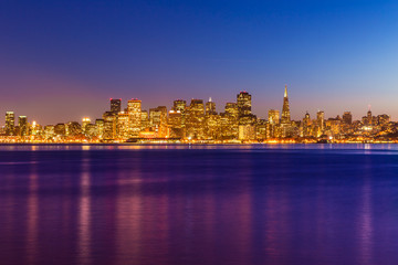 Obraz na płótnie Canvas San Francisco sunset skyline California bay water reflection