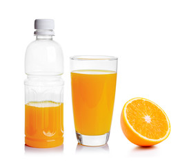 Plastic bottle and glass of orange juice