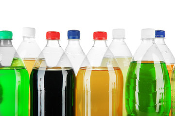Assortment of bottles with tasty drinks, isolated on white