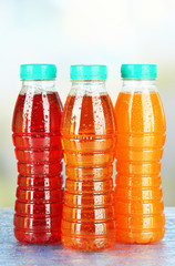 Assortment of bottles with tasty fruit juices