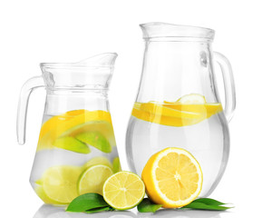Cold water with lime, lemon and ice in pitchers isolated