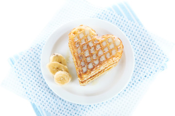 Sweet Belgium waffles with banana, isolated on white