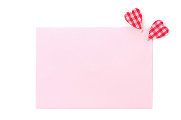 a pink card for congratulation with hearts, close-up, isolated