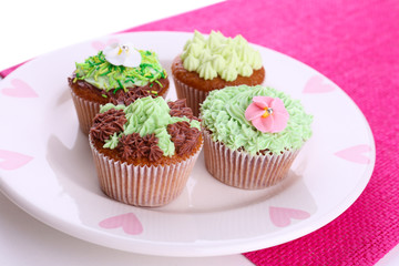 Tasty cupcakes with butter cream,