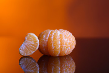 Ripe sweet tangerine, on dark color background