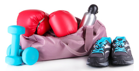 Sports bag with sports equipment isolated on white