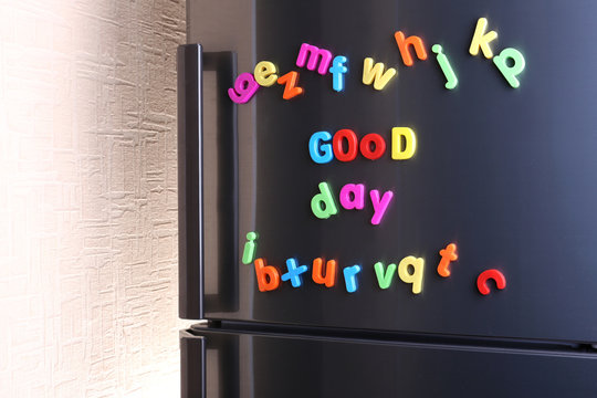 Colorful magnetic letters on  refrigerator