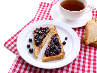 Delicious toast with jam on plate close-up