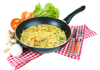 Omelet with vegetables isolated on white
