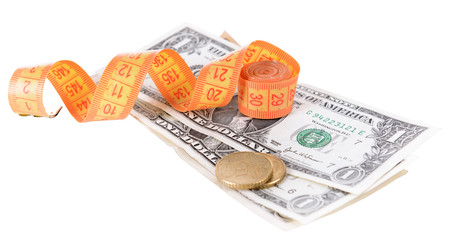 Tape measure with money isolated on white