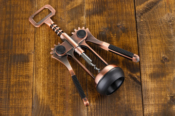 Corkscrew on wooden background