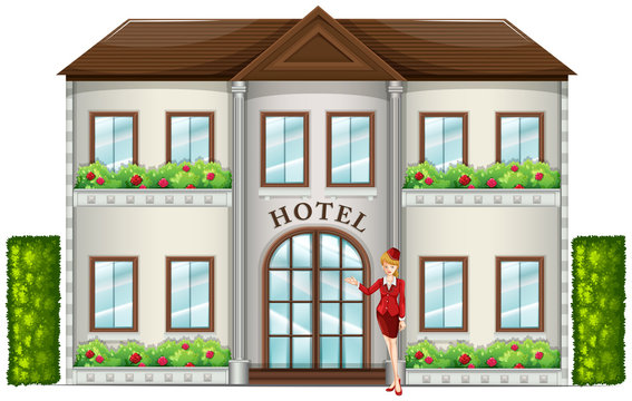 A hotel attendant standing in front of the hotel