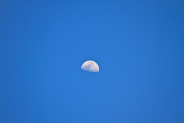 half  moon in blue sky