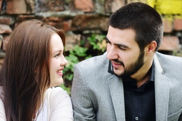 Lovely couple enjoying fall in love at park