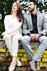 Lovely couple enjoying fall in love at park