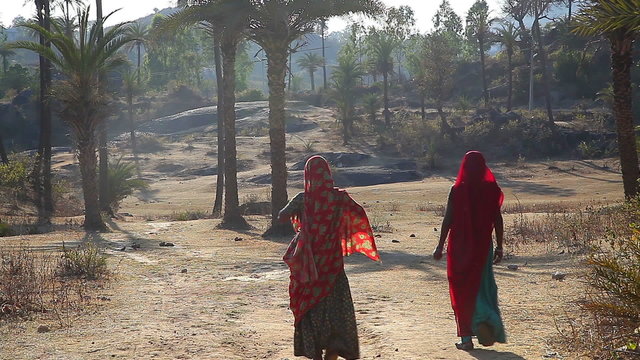 Indian women are on a rural road