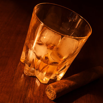 whiskey on ice and cigar
