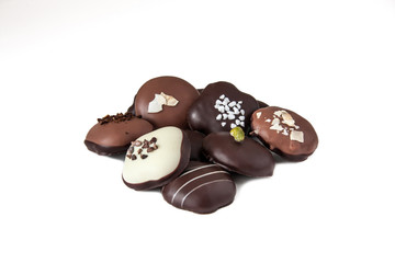 different varieties of chocolate and sweets on a white backgroun