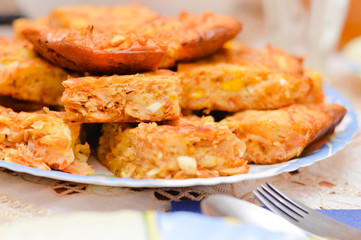 Cabbage and egg pie pieces on plate