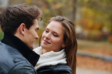 Fototapeta premium Lovely couple enjoying fall in love at park