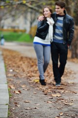 Obraz premium Lovely couple enjoying fall in love at park