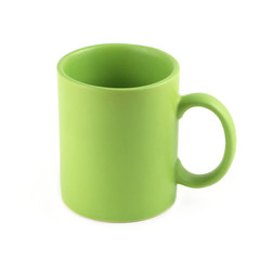 Green empty tea or coffee cup isolated on white closeup
